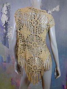 This 1970s European vintage beige lace design crochet vest has an open front that is long enough in the front to allow you to tie it closed if you like. The vest features 4-inch (10.16cm) hemline fringe. Bust = 40 inches (101.6cm) Vest Length (front) = 30 inches (76.2cm) Vest Length (back) = 33 inches (83.82cm) Size: 12 US, 16 UK Material: Wool, Acrylic Condition: Excellent (clean, soft, and supple, with no stains, tears, wear spots, or weaknesses in the seams) --- DESCRIPTION ASSURANCE --- I wa 2024 Art, Beige Crochet, Design Crochet, Uk Photos, Crochet Vest, 1960s Fashion, European Vintage, Plaid Blazer, Vintage Summer