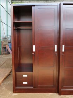 two large wooden closets sitting next to each other