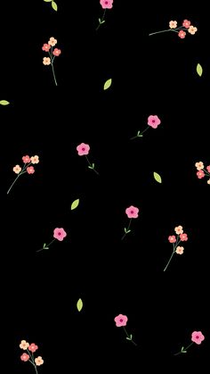 a black background with pink flowers and green leaves