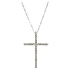 Delicately crafted for a timeless look, this 14KT white gold cross necklace is set with 0.11CT-TW of round brilliant cut diamonds for a luxe finish. When you wear this delicately crafted 14KT white gold cross necklace, you'll elevate your style thanks to the 0.11CT-TW of round brilliant cut diamonds that give it a timeless, luxurious look. Length 18 inches. Weight 0.9 grams. Gold Diamond Cross Necklace, White Gold Cross Necklace, Diamond Cross Necklace Gold, Diamond Cross Necklace, Diamond Heart Pendant Necklace, Gold Hamsa, White Gold Sapphire, Diamond Solitaire Necklace, Three Stone Diamond