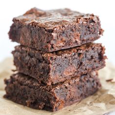 three chocolate brownies stacked on top of each other