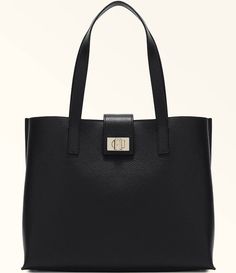 From Furla&#x2C; the 1927 Large 36 Soft Tote Bag features:Grained leatherCentral partition with zip closureTwist closure with the Furla logo engraved on the front Spacious and versatileMetal feet Approx.: 14.17" L x 11.22" H x 5.70" WImported. Classic Everyday Shoulder Bag With Logo Hardware, Modern Bags With Logo Hardware For Daily Use, Modern Bags With Logo Hardware, Luxury Shoulder Bag With Logo Hardware For Daily Use, Elegant Tote Bag With Logo Hardware, Satchel Bag With Logo Hardware For Daily Use, Classic Bags With Logo Hardware For Everyday Use, Everyday Satchel Bag With Logo Hardware, Everyday Shoulder Bag With Logo Hardware