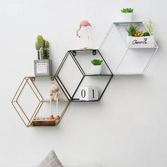 Functionally beautiful, the Onni Hexagon Shelf adds a modern touch to any wall. The hexagon-shaped metal frame holds 3 staggered shelves to display your favorite books, photos, accessories, and more. Designed to be sufficiently subtle, this wall shelf will surely give any vacant space completion and balance. PRODUCT DETAILS Durable metal iron frame and base Black/White/Gold Hook or bolt-insert installation Includes 1 shelf OVERALL DIMENSIONS Inches Centimeters 10" H x 11” W x 4” D 25 H x 28.5 W x 10 D White Floating Shelf, Hexagon Wall Shelf, Wall Shelves Living Room, Metal Wall Shelves, Hexagon Shelves, Iron Storage, Round Storage, Floating Wall Shelves, Estantes Flotantes