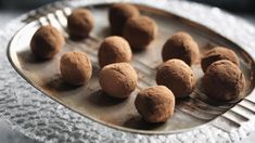 chocolate truffles on a metal tray with a fork