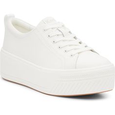 "Find Keds® Skyler Platform Sneaker on Editorialist. A chunky platform sole adds bold style to this classic sneaker crafted from smooth leather and cushioned by a comfy Softerra footbed. 2\" platform Cushioned footbed Leather upper/textile lining/rubber sole Imported Product label may differ from images shown" White Slip-on Platform Sneakers With Thick Bottom, White Low-top Calf Leather Platform Sneakers, White Calf Leather Low-top Platform Sneakers, White Mid-top Platform Sneakers With Cushioned Footbed, White Platform Sneakers With Rubber Sole, Medium Fit, Platform Sneaker, Bold Style, Chunky Platform, Classic Sneakers