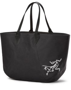 a black tote bag with white drawings on it