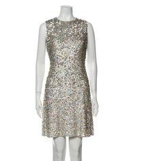 a mannequin wearing a dress with sequins on it