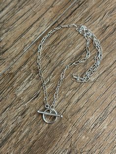 This Sterling Silver (.925) long and short chain mini toggle necklace is beautiful and all components are made with solid Sterling Silver (note that this is not stainless steel, is not silver plated nor dipped).       I love this dainty chain- the Sterling Silver chain is made with long and short oval links that are 6.3mm long and 2.7 mm long.   There are several chain lengths available, please select length in the drop down menu when ordering.  If you would like another size, please message me.    The Sterling Silver Toggle Clasp is small and dainty and measures 14 mm.      Details- * .925 Solid Silver Sterling Long and Short Chain, oval links are alternating and long links are 6.3 mm long and short are 2.7 mm * Sterling Silver Toggle clasp that is approximately 14 mm  * Please check all Toggle Necklace, Dainty Chain, Necklace Sterling Silver, Toggle Clasp, Necklace Chain, Necklace Silver, Sterling Silber, Chain Lengths, Sterling Silver Chains