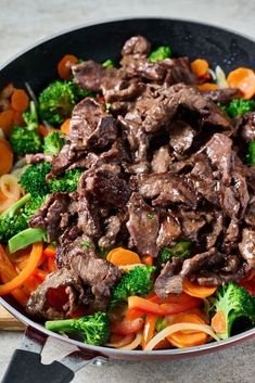 beef and vegetable stir fry in a skillet