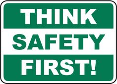 a green and white sign that says think safety first