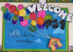 a welcome sign with colorful balloons attached to it