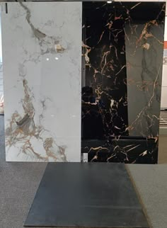 three different types of marble on display in a store