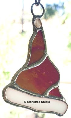 a stained glass ornament hanging from a chain