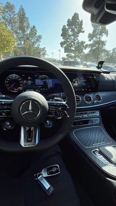 the interior of a mercedes benz car with its steering wheel and dash lights on display