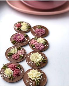 chocolate buttons decorated with flowers and pearls