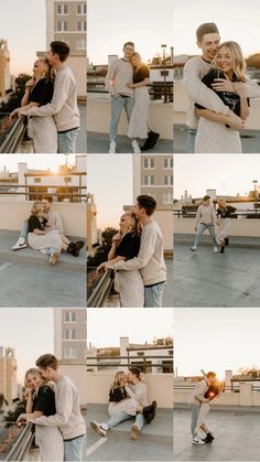 a man and woman hugging each other on top of a roof in front of some buildings