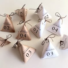 the numbers are numbered in different shapes and sizes as well as tied with twine