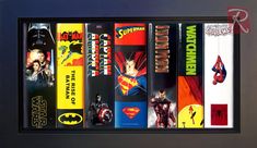 an image of a bunch of comic books in a black frame with batman and superman logos on them