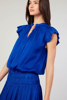 Done in an alluring cobalt hue, this short-sleeve mini dress ties up at the neckline and cinches in at the waist before falling to a thigh-skimming tiered hem with crisp, raw edges. The perfect one-and-done number for date night - not to mention one of Current Air's most popular dress. •V-neckline with tie •Classic fit •Ruffle trim •Pleated cap sleeves •Elasticized waist •Tiered pleated skirt •Raw edges Item number 1990061-1 100% Polyester Gentle Cycle Cold Blue Mini Dress With Ruffle Hem And Short Sleeves, Blue Short Sleeve Mini Dress With Ruffle Hem, Popular Dress, Personal Color, Pleated Mini Dress, Popular Dresses, Short Sleeve Mini Dress, Print Trends, Sweater Sale