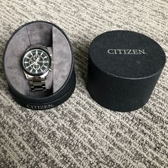 This Is A New Men’s Citizen Watch. It’s A Really Sharp Looking Watch That My Husband Had Every Intention Of Wearing For Nice Events But He’s Now Owned It For 4 Years And Has Never Worn It! Clearly Not A Watch Guy The Battery Is Dead And Needs To Be Replaced Otherwise It’s In Perfect Condition Since It’s Only Left The Box To Take These Pictures. I Honestly Don’t Know Anything About This Watch So Am Including Lots Of Pictures. We Bought It At A Kay Jewelry Outlet And Still Have The Receipt. Modern Silver Chronograph Watch For Anniversary, Classic Silver Chronograph Watch For Formal Occasions, Silver Chronograph Watch For Business, Luxury Silver Chronograph Watch With Stainless Steel Clasp, Modern Watch Accessories For Anniversary, Silver Automatic Chronograph Watch For Anniversary, Silver Automatic Watch As Gift, Silver Automatic Watches As A Gift, Silver Automatic Watches As Gift