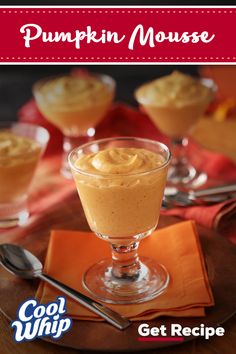 pumpkin mousse is served in small glasses with spoons and napkins on the side