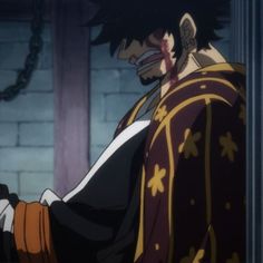 an anime character with black hair wearing a red and gold outfit holding his hand out