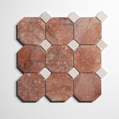 a red and white marble tile with hexagonal shapes