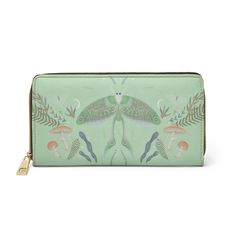 Mint Green Luna Moth Witchy Zipper Wallet, Vegan leather mushroom Fern full zip clutch wallet cards organizer phone purse For carrying around all your credit cards, cash, and driver's licenses look no further than this personalized wallet. Made with cruelty-free vegan leather, this wallet comes packed with utility and style.  .: Material: Cruelty-free vegan leather .: Durable high-quality nylon zip and alloy hardware .: Gold color thread stitching .: Pockets for cash, credit cards, coins, and ch Green Zipper Clutch Wallet, Leather Mushroom, Luna Moth, Card Organizer, Personalized Wallet, Clip Wallet, Phone Purse, Money Clip Wallet, Zipper Wallet