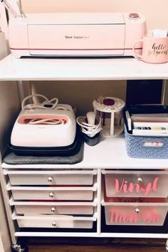 a sewing machine sitting on top of a white shelf next to other crafting supplies