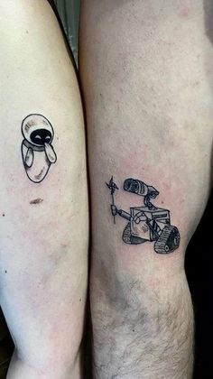 two people with tattoos on their legs, one has an astronaut and the other has a rocket