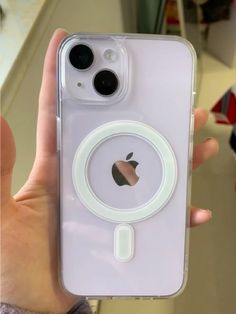 someone is holding up their iphone case with an apple logo on it