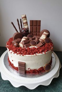 there is a cake with chocolate and candy on it