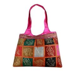 By Om Prakash this dazzling handbag showcases India's traditional block print art in gold. The motifs appear on both front and back and glittering sequins add a festive feel. Fully lined the purse features an inner pocket that zips closed. Each tote is a handcrafted work of art therefore motifs colors and their placement can vary. The theme will be the same. Block Print Art, Colorful Handbags, Blue Handbags, Family Crafts, Pink Tote, Premium Gift, Tote Handbag, Womens Fashion For Work, Free Gift Wrapping