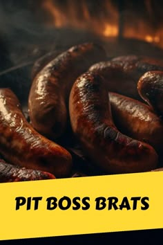 some sausages are cooking on a grill with the words pit boss brats over it