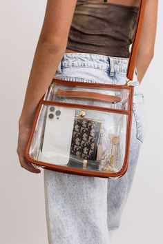 The Crystal Clear Carry-All Messenger Bag is perfect for your on-the-go needs. Keep your belongings safe and organized in this stylish and transparent bag. With its clear design, you'll never have to search for your items again. Stay chic and trendy with this fun and happy bag! #lovemyleto 100% PVC Imported Clear Satchel Bag For Travel, Clear Portable Shoulder Bag For Daily Use, Trendy Clear Travel Satchel, Trendy Clear Satchel For Travel, Portable Clear Shoulder Bag For Daily Use, Trendy Shoulder Bag With Clear Strap For Daily Use, Trendy Crossbody Satchel With Clear Strap, Everyday Portable Clear Bag, Portable Clear Bag For Everyday Use