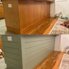 two pictures of the same kitchen counter top and wood flooring in different stages of being painted