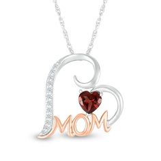 Surprise Mom with this regal red garnet and white lab-created sapphire tilted heart pendant - an elegant and meaningful look she'll love to wear. Fashioned in sterling silver This heart-shaped outline design showcases the word "Mom" sculpted in an uppercase cursive font in 10K rose gold across the bottom. A 5.0mm heart-shaped red garnet glistens above. White lab-created sapphires adorn the outline for a touch of shimmer. This pendant suspends slightly askew along an 18.0-inch rope chain that sec Uppercase Cursive, Outline Design, Outline Designs, Cursive Font, White Lab, Peoples Jewellers, Red Garnet, Showcase Design, Rope Chain