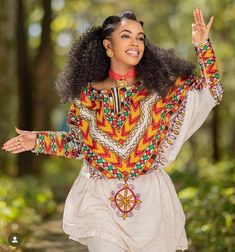 Embroidered habesha wear Bohemian Habesha Kemis With Traditional Patterns, Ethiopian Fabric, Eritrean Dress, Habesha Dress, Habesha Kemis, Yarn Gifts, Blues And Greens, Cultural Events, Flowing Skirt