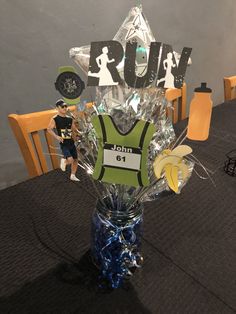 a vase filled with flowers on top of a table next to a sign that says run