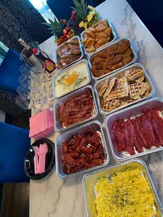 a table topped with lots of different types of food