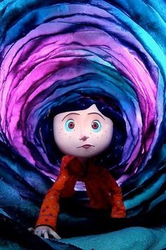 a doll sitting in the middle of a blue and purple swirly tunnel with eyes wide open