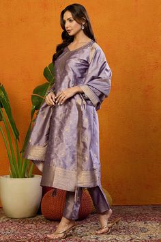 Grab this beautiful 3-piece set. The set comes with ethnic motif printed straight shape kurta has v neck, 3/4th sleeves & calf length teamed with solid trouser pant with side pocket and a dupatta. Color - Lavender Kurta Fabric-Silk Blend Pant Fabric-Silk Blend Dupatta Fabric - Silk Blend Neck-V Neck Sleeves-3/4th Sleeves Work -Ethnic Motif Print Detailing Washing Instructions-Dry Clean DISCLAIMER - The color of the product may be differ due to screen settings of device. A misprint here and a color drop slip there is the beauty of printing which is not treated as a defect. Printed Suit, Lavender Silk, Formal Jewelry, Fabric Silk, Churidar, Suit Set, Fabric Shop, Formal Wedding, Casual Party