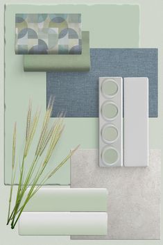 the wall is painted green and blue with white trim, along with two different shades of paint