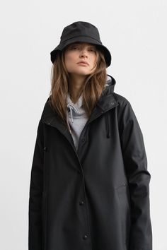 Stutterheim Mosebacke long raincoat black flowing A-line women | PIPE AND ROW boutique Long Raincoat, Rains Long Jacket, Raincoat Outfit, Black Raincoat, Long Rain Coat, Stockholm Style, Long Cut, Raincoats For Women, Stockholm Fashion