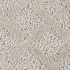 an up close shot of a carpet textured with white and beige colors, which is very soft