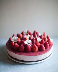 there is a cake with strawberries on it