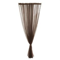 a brown curtain hanging on the side of a white wall