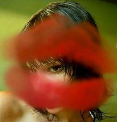 a blurry photo of a woman's face with red circles around her head