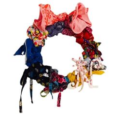 an assortment of scarves are arranged in the shape of a wreath on a white background