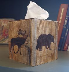 a tissue dispenser with an image of a bear and moose on it